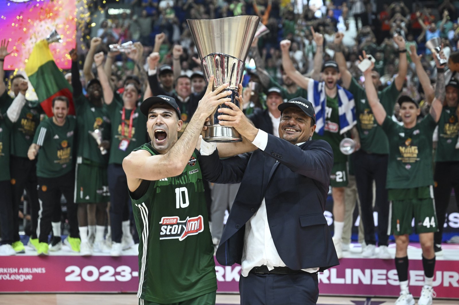 Panathinaikos' captain Kostas Sloukas (L) and coach Ergin Ataman raise the EuroLeague trophy after beating Real Madrid in the final, Berlin, Germany, May 26, 2024. (AA Photo)