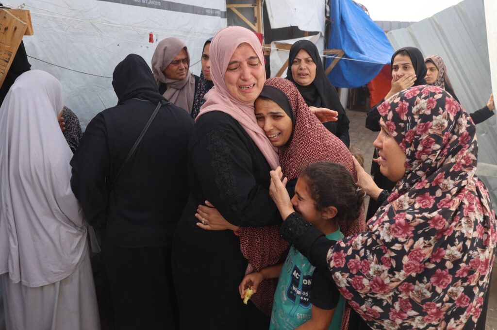 Palestinians mourn by the bodies of relatives killed after an Israeli strike on a camp for internally displaced people in Rafah, Palestine, May 27, 2024. (AFP Photo)