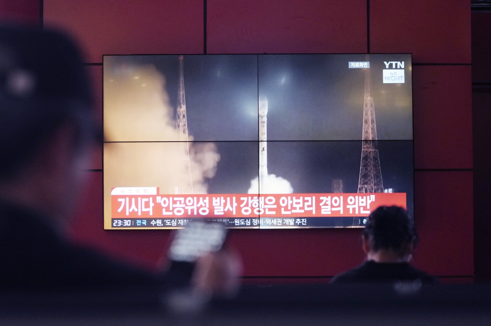 A TV screen shows a file image of North Korea's rocket launch during a news program at a bus terminal in Seoul, South Korea, Monday, May 27, 2024. (AP Photo)