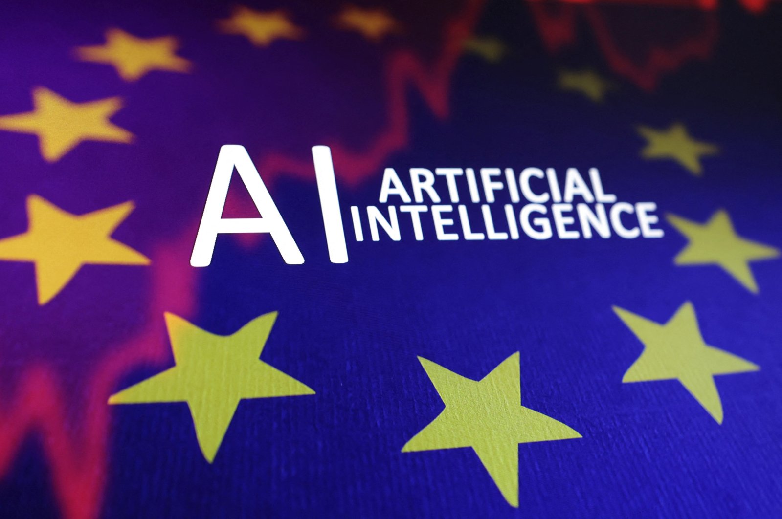 The EU flag, a stock graph and the words "AI Artificial Intelligence" are seen in this illustration taken May 21, 2024. (Reuters Photo)