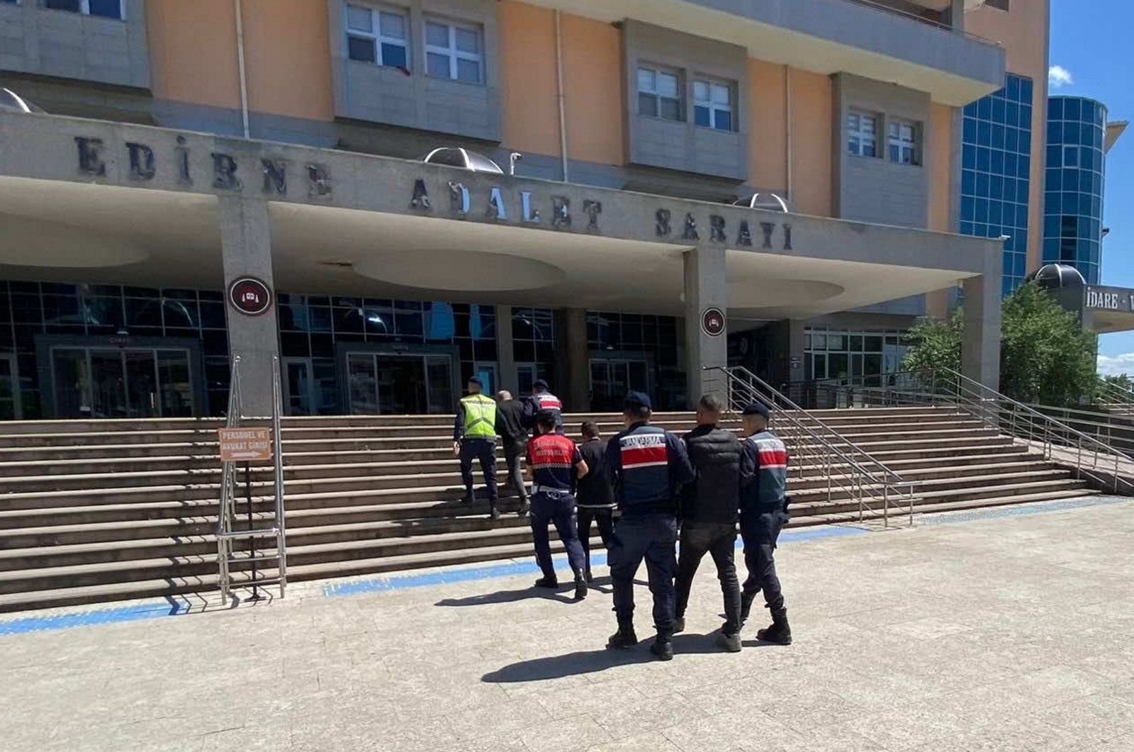 Police escort 12 suspected members of terrorist groups, including the PKK, Daesh and the Gülenist Terror Group (FETÖ), caught trying to flee the country in northwestern Edirne province, Türkiye, May 23, 2024. (AA Photo)