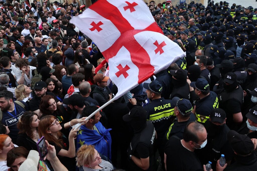 A woman waves a Georgian national flag as she protests the "foreign influence" law outside the parliament building in central Tbilisi, Georgia, May 28, 2024. (AFP Photo)