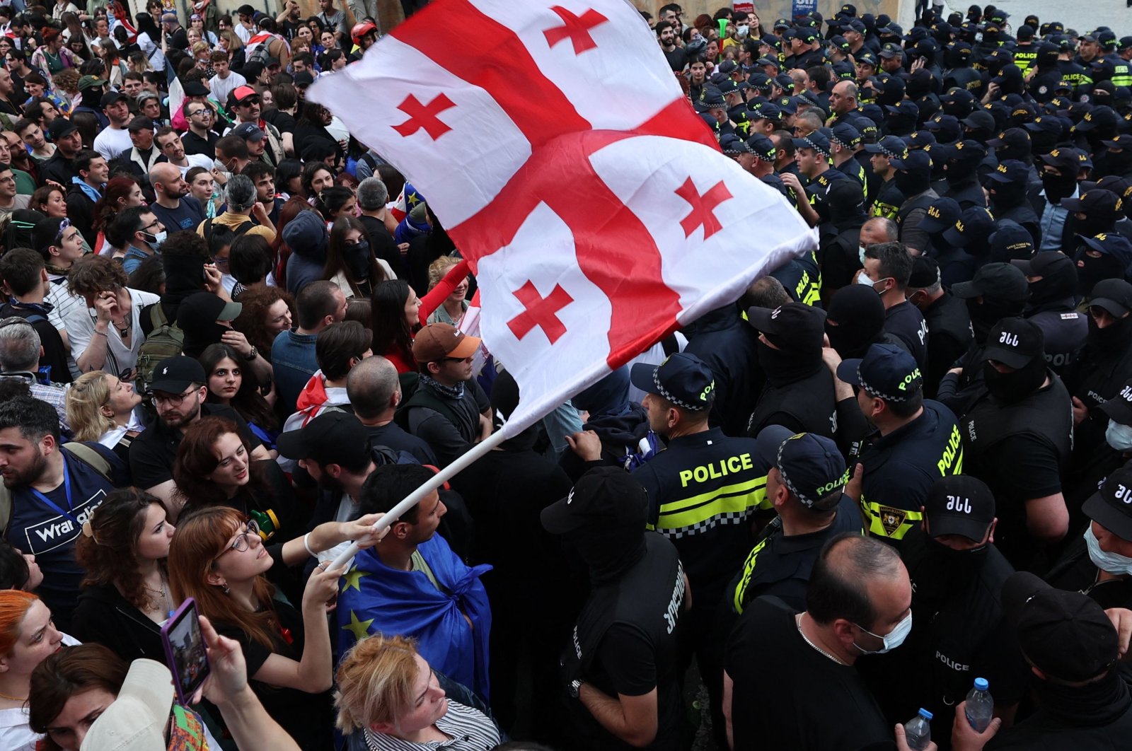 A woman waves a Georgian national flag as she protests the "foreign influence" law outside the parliament building in central Tbilisi, Georgia, May 28, 2024. (AFP Photo)