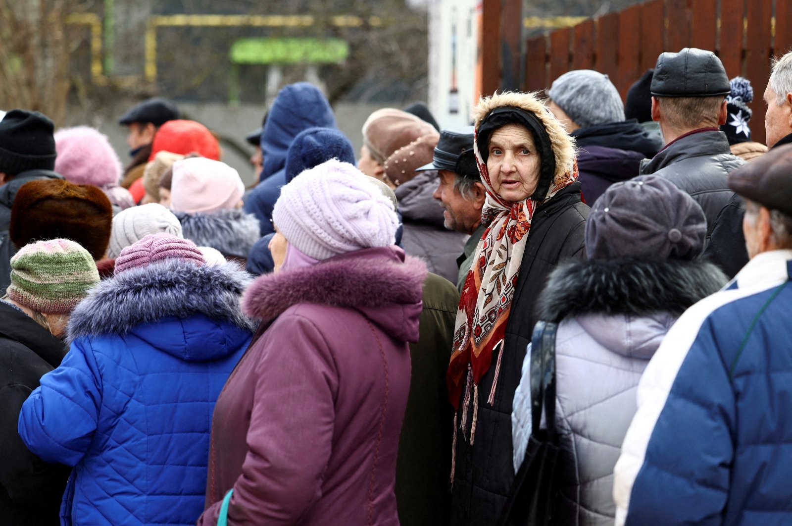 People queue for meals from World Central Kitchen food truck on a street in Kherson, Ukraine, Feb. 22, 2023. (Reuters Photo)