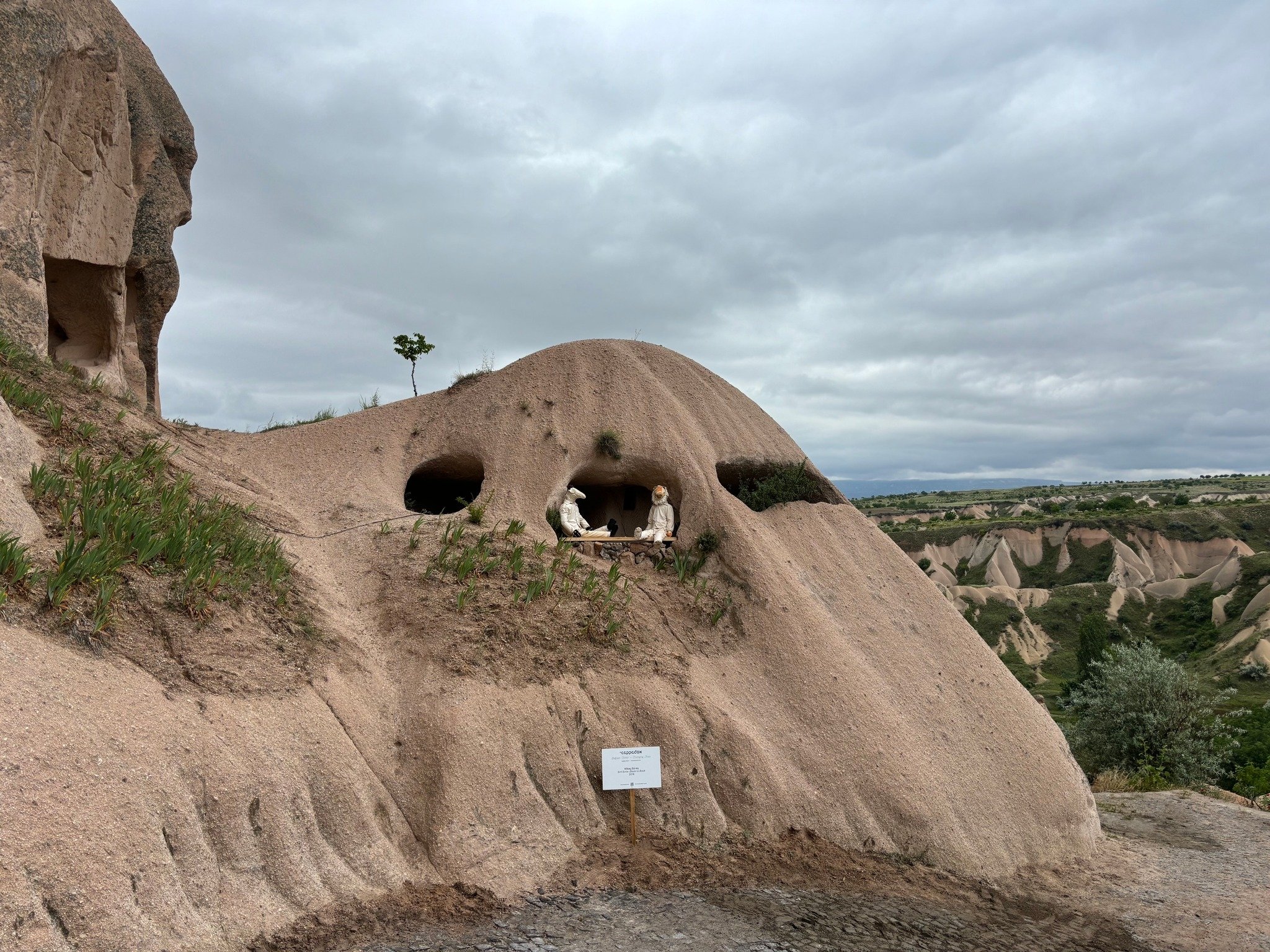 330584 Two aliens sitting in the holes of the cave in a space-themed setting, Cappadocia, Türkiye, May 26, 2024. (Photo by Funda Karayel)