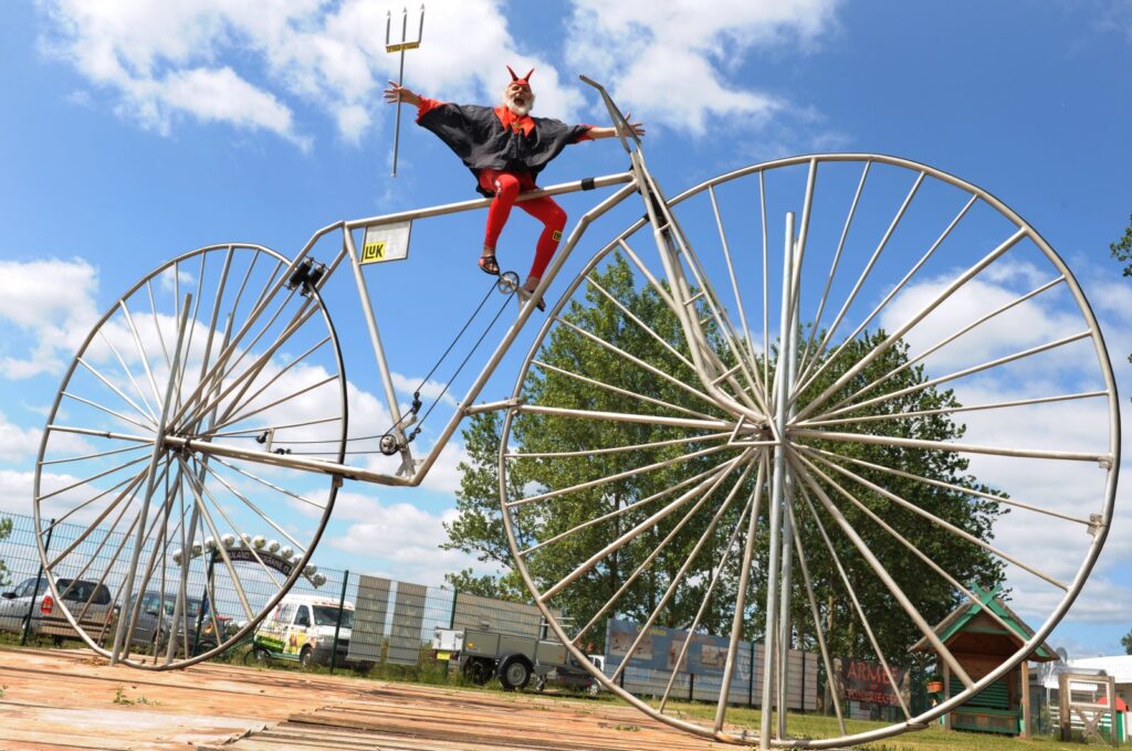 Bicycle designer Dieter (Didi) Senft sits on what its creator claims is the "largest functional bicycle in the world," Pudagla, Germany, June 1, 2012. (DPA Photo)
