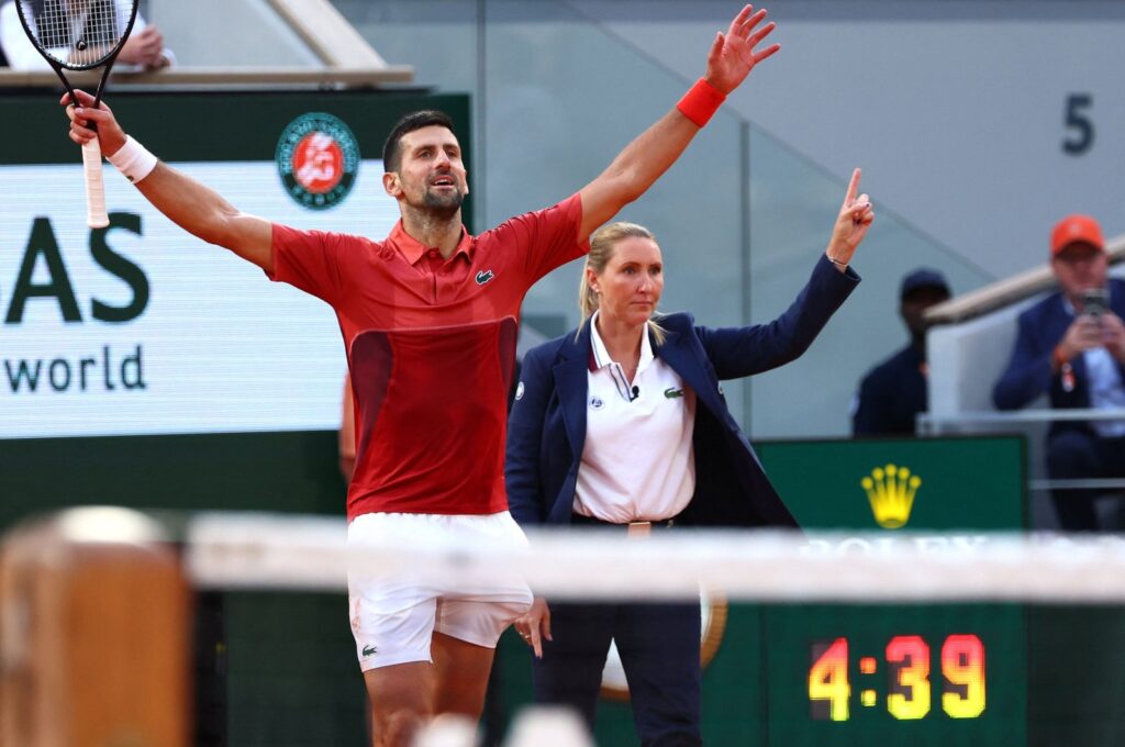 Serbia's Novak Djokovic (L) celebrates next to the umpire after winning against Argentina's Francisco Cerundolo at the end of their men's singles round of 16 match on Court Philippe-Chatrier on day nine of the French Open tennis tournament at the Roland Garros Complex, Paris, France, June 3, 2024. (AFP Photo)