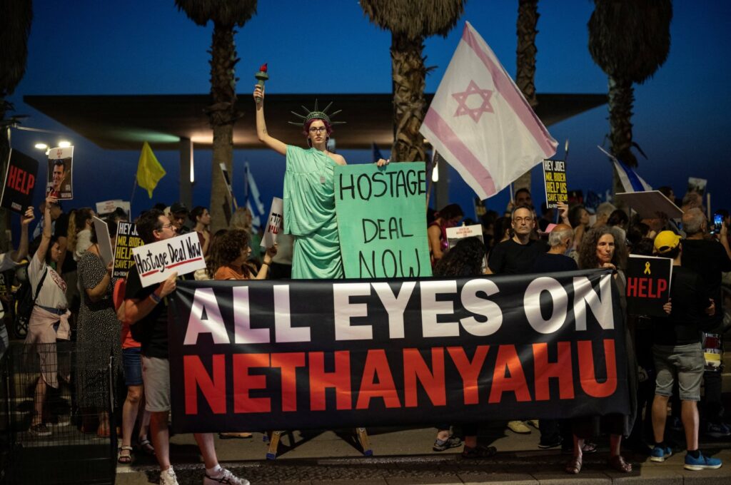 A demonstrator poses as the Statue of Liberty as supporters and families of hostages, who were kidnapped during Oct. 7 incursion are seen in Tel Aviv, Israel, June 3, 2024. (Reuters Photo)