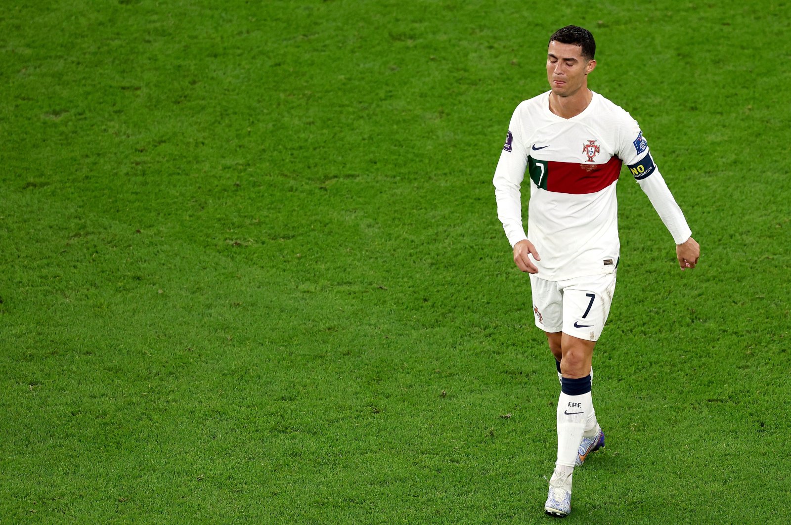 Portugal's Cristiano Ronaldo walks off the pitch after the team's defeat during the FIFA World Cup Qatar 2022 quarter final match against Morocco at Al Thumama Stadium, Doha, Qatar, Dec. 10, 2022. (Getty Images Photo)
