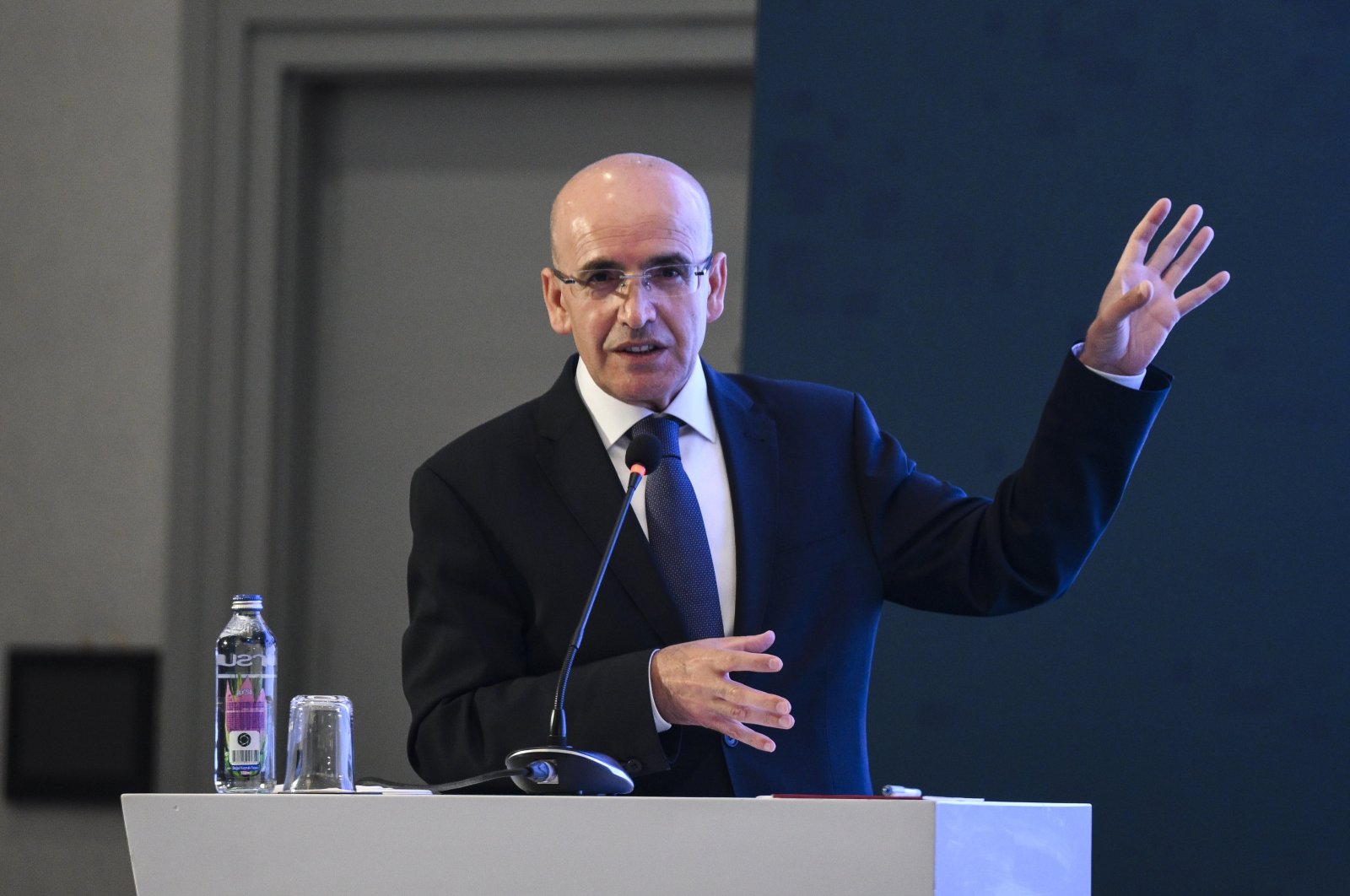 Treasury and Finance Minister Mehmet Şimşek delivers a speech during an event in Istanbul, Türkiye, May 29, 2024. (AA Photo)