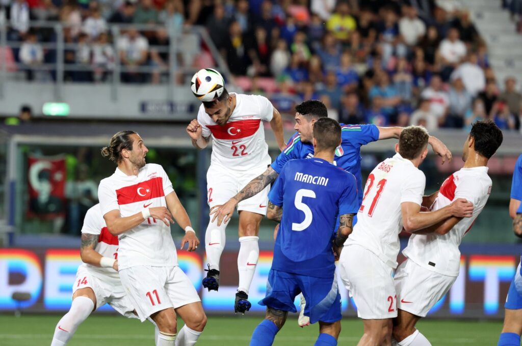 Türkiye's Kaan Ayhan (C) heads the ball during the international friendly match against Italy at the Renato Dall'Ara Stadium, Bologna, Italy, June 4, 2024. (IHA Photo)