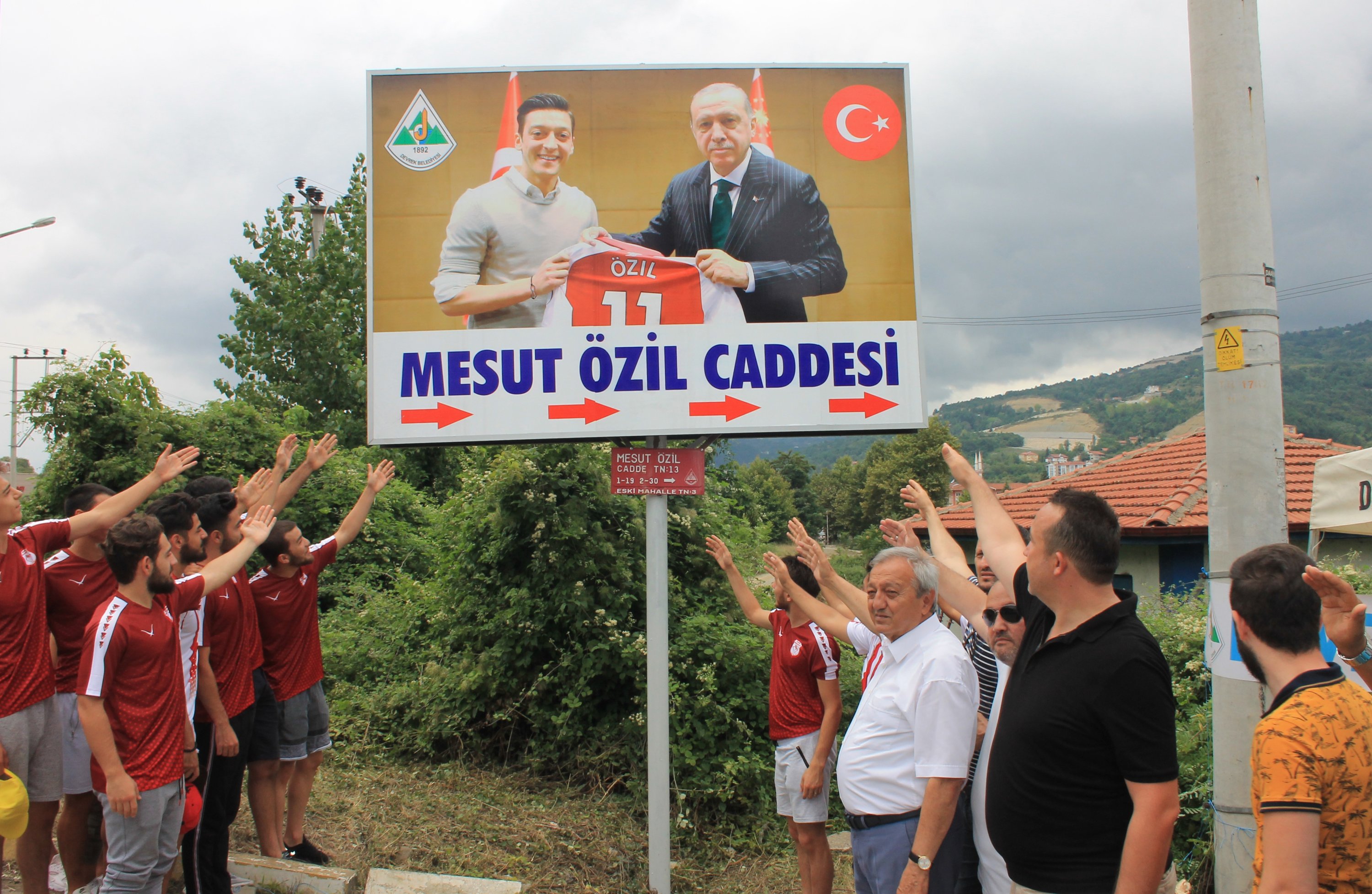 331372 The photo of Mesut Ozil and President Recep Tayyip Erdoğan is displayed in large format on the sign in Devrek pointing to Mesut-Ozil Street, Devrek, Türkiye, July 24, 2018. (Getty Images Photo)