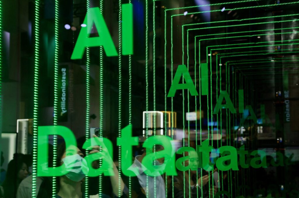 A person takes a photo of an AI data sign at Computex in Taipei, Taiwan, June 5, 2024. (Reuters Photo)