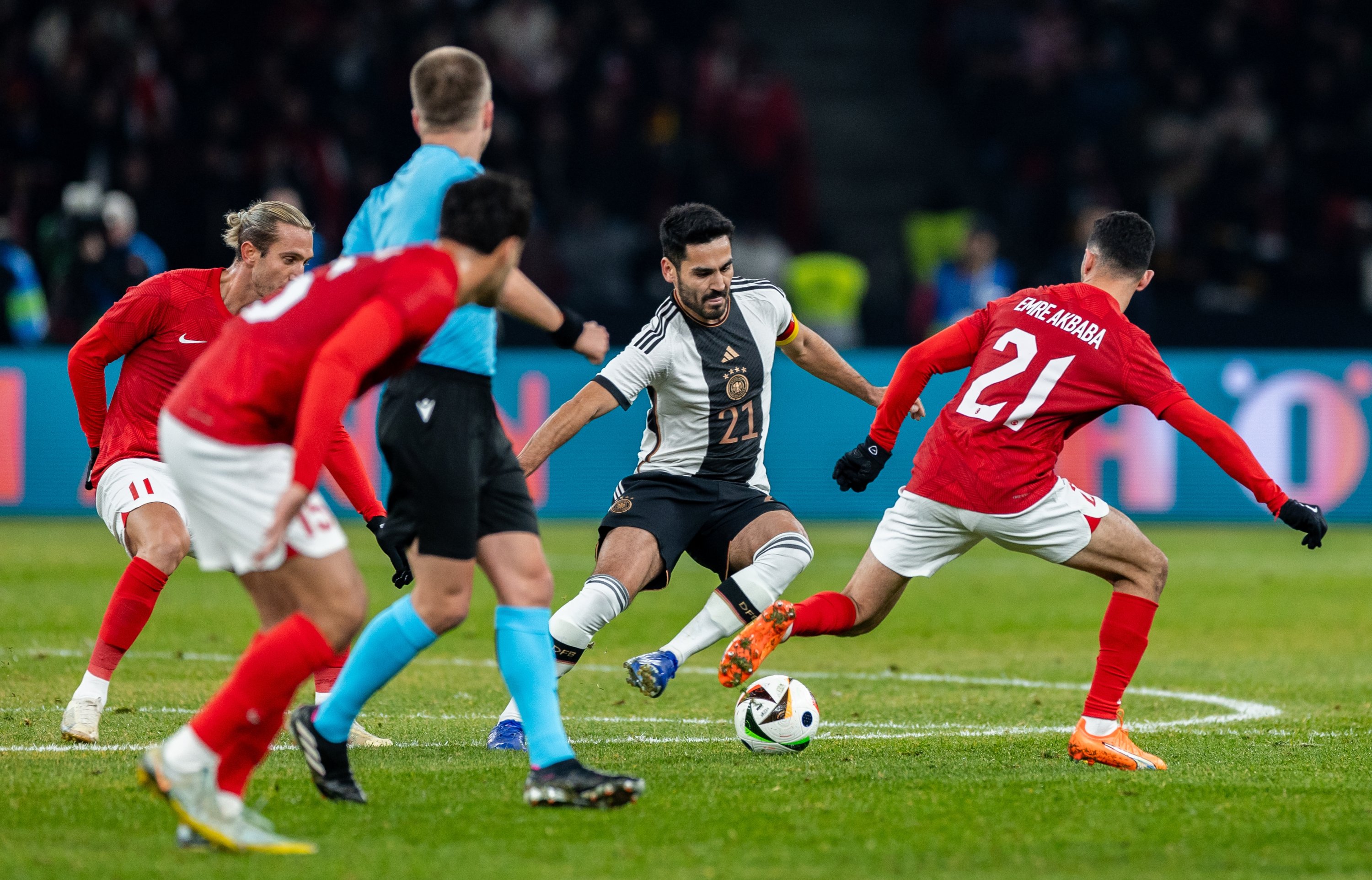 331474 Germany's Ilkay Gündoğan (2nd R) is challenged by Türkiye's Emre Akbaba (R) during an international friendly match at Olympiastadion, Berlin, Germany, Nov. 18, 2023. (Getty Images Photo)