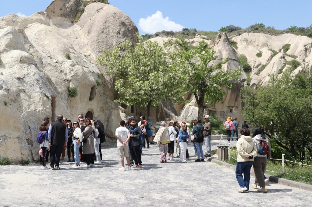 A group of tourists is photographed in the famed Capadoccia region, central Türkiye, May 16, 2024. (AA Photo)