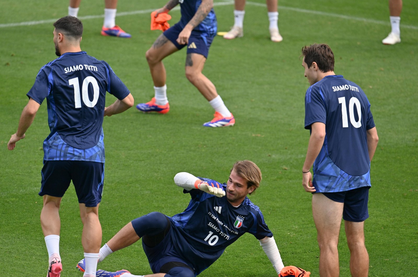From left, Riccardo Orsolini, Ivan Provedel and Federico Chiesa of Italy attend a training session in Coverciano, Florence, June 3, 2024. (EPA Photo)