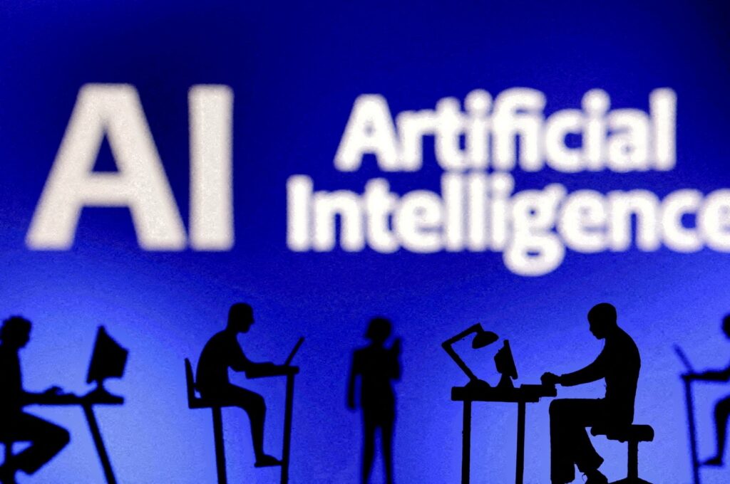 Figurines with computers and smartphones are seen in front of the words "Artificial Intelligence AI" in this illustration taken Feb. 19, 2024. (Reuters Photo)