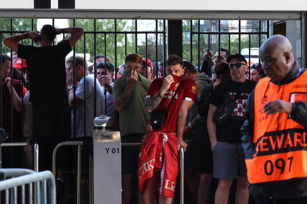 Liverpool fans are held at the gates, many feeling the effects of tear gas ahead of the UEFA Champions League final match between Liverpool and Real Madrid at Stade de France, Paris, France, May 28, 2022. (Getty Images Photo)