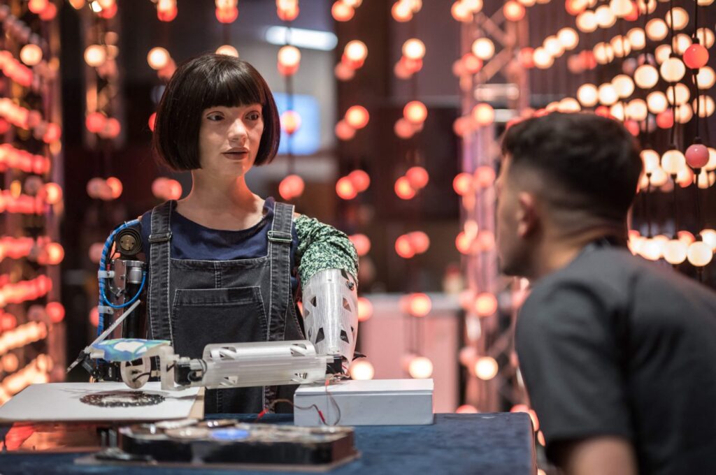 A man faces the realistic artist robot "Ai-Da" using artificial intelligence at a stand during the International Telecommunication Union (ITU) AI for Good Global Summit, Geneva, Switzerland, May 30, 2024. (AFP Photo)