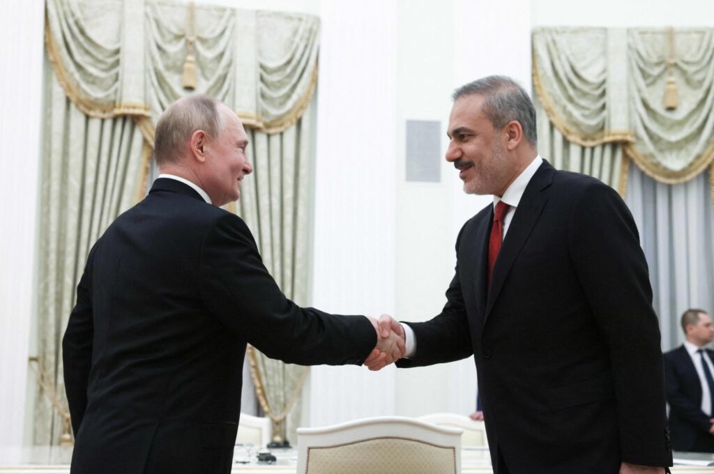In this pool photograph distributed by Russian state agency Sputnik, Russia's President Vladimir Putin attends a meeting with Foreign Minister Hakan Fidan (R) in Moscow on June 11, 2024. (AFP Photo)