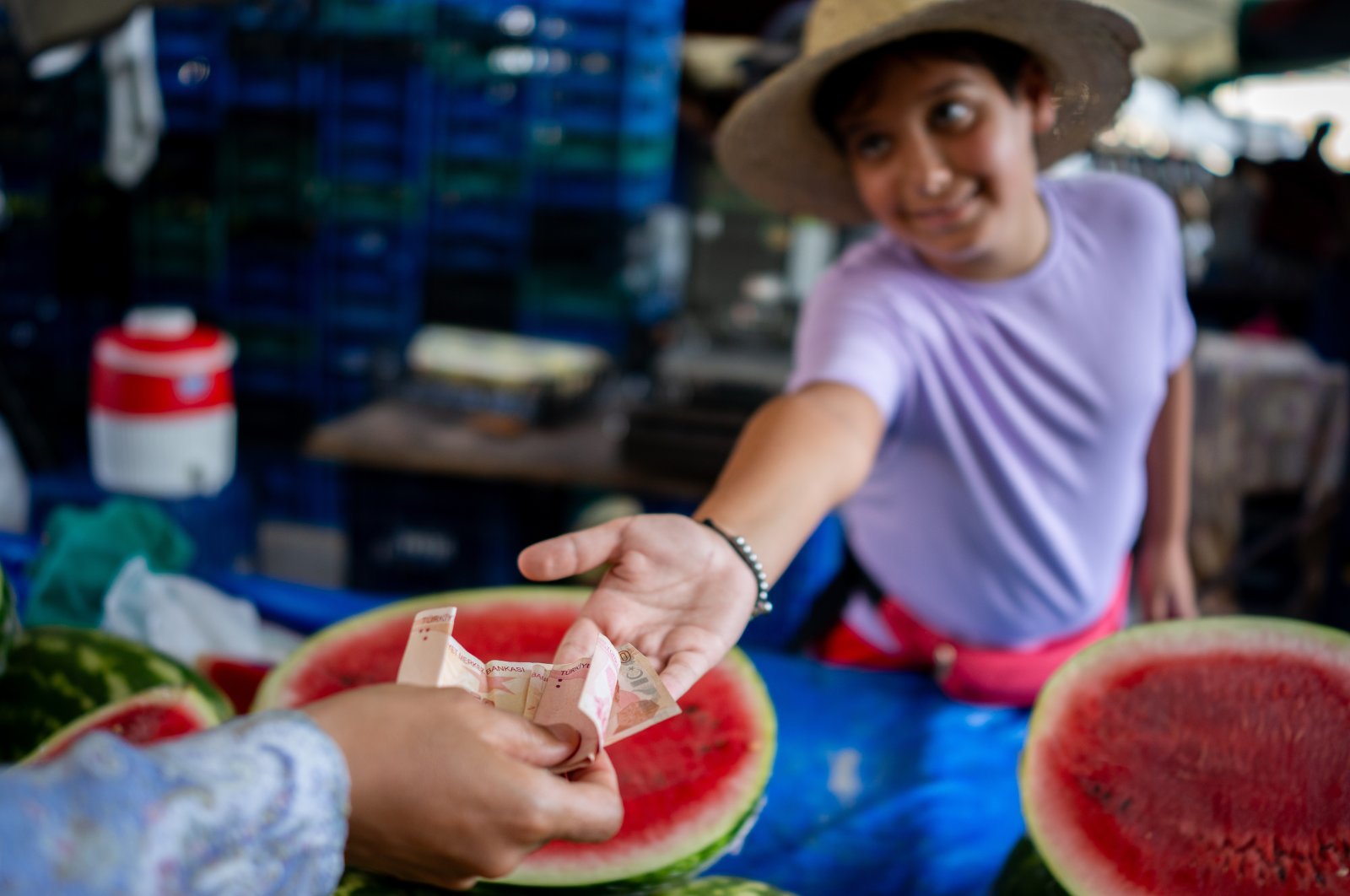 A boy sells fruits in a bazaar, March 3, 2023. (Getty Images Photo)
