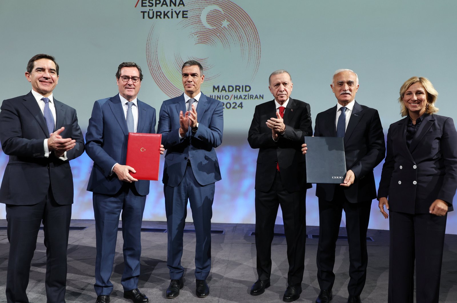 President Recep Tayyip Erdoğan (3rd R) and Spain's Prime Minister Pedro Sanchez (3rd L) attend the Türkiye-Spain Business Forum in Madrid, Spain, June 13, 2024. (AA Photo)