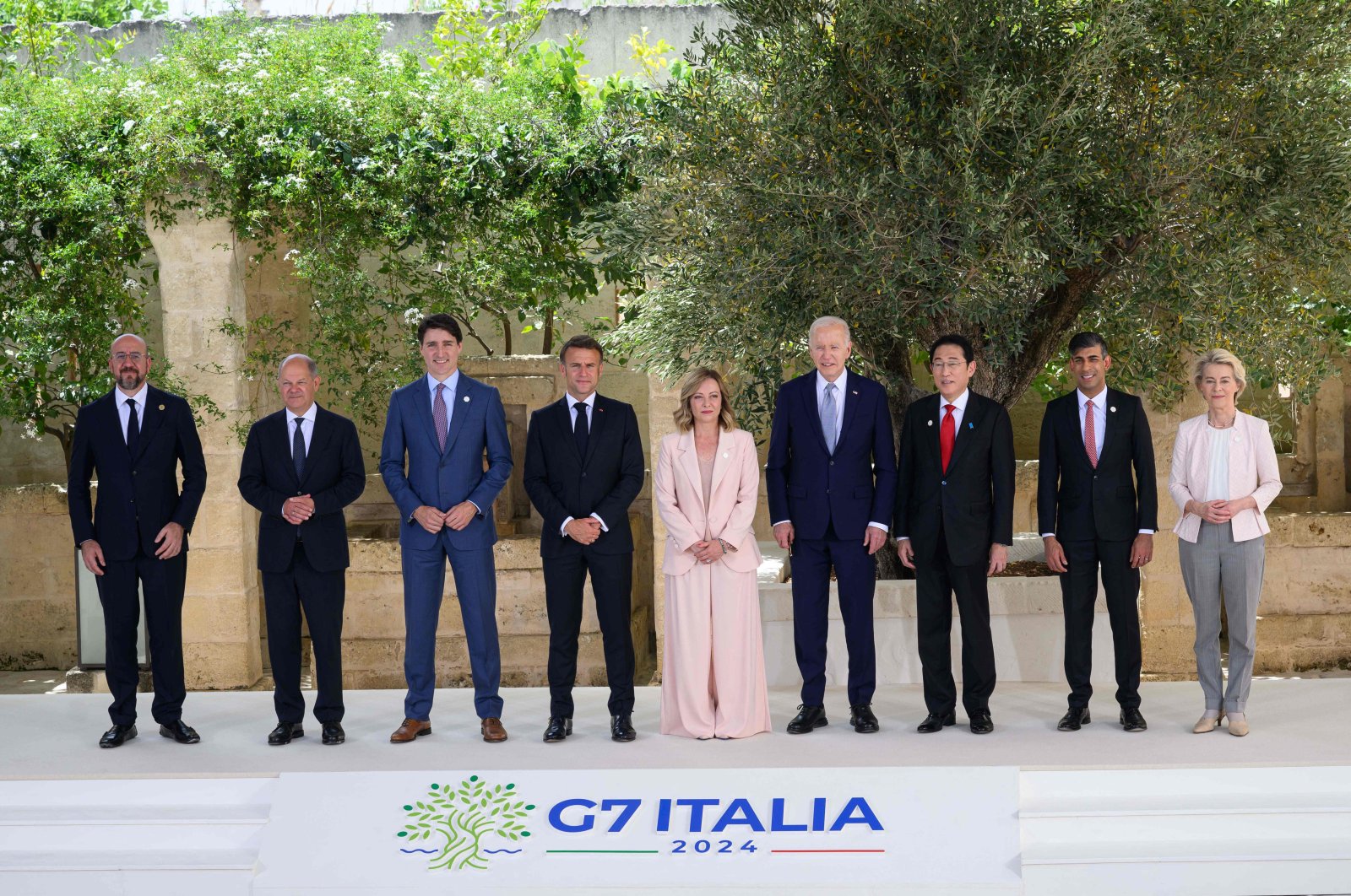 From left, European Council President Charles Michel, German Chancellor Olaf Scholz, Canadian Prime Minister Justin Trudeau, French President Emmanuel Macron, Italy's Prime Minister Giorgia Meloni, U.S. President Joe Biden, Japanese Prime Minister Fumio Kishida, British Prime Minister Rishi Sunak and President of the European Commission Ursula von der Leyen pose for a family photo during the G-7 Summit in Apulia region, Italy, June 13, 2024. (AFP Photo)