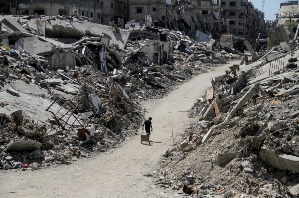 A Palestinian walks among the rubble of buildings destroyed by Israel's military offensive, in Beit Lahia, northern Gaza Strip, Palestine, June 12, 2024. (Reuters Photo)