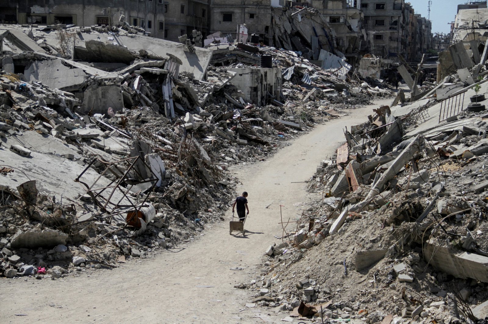 A Palestinian walks among the rubble of buildings destroyed by Israel's military offensive, in Beit Lahia, northern Gaza Strip, Palestine, June 12, 2024. (Reuters Photo)