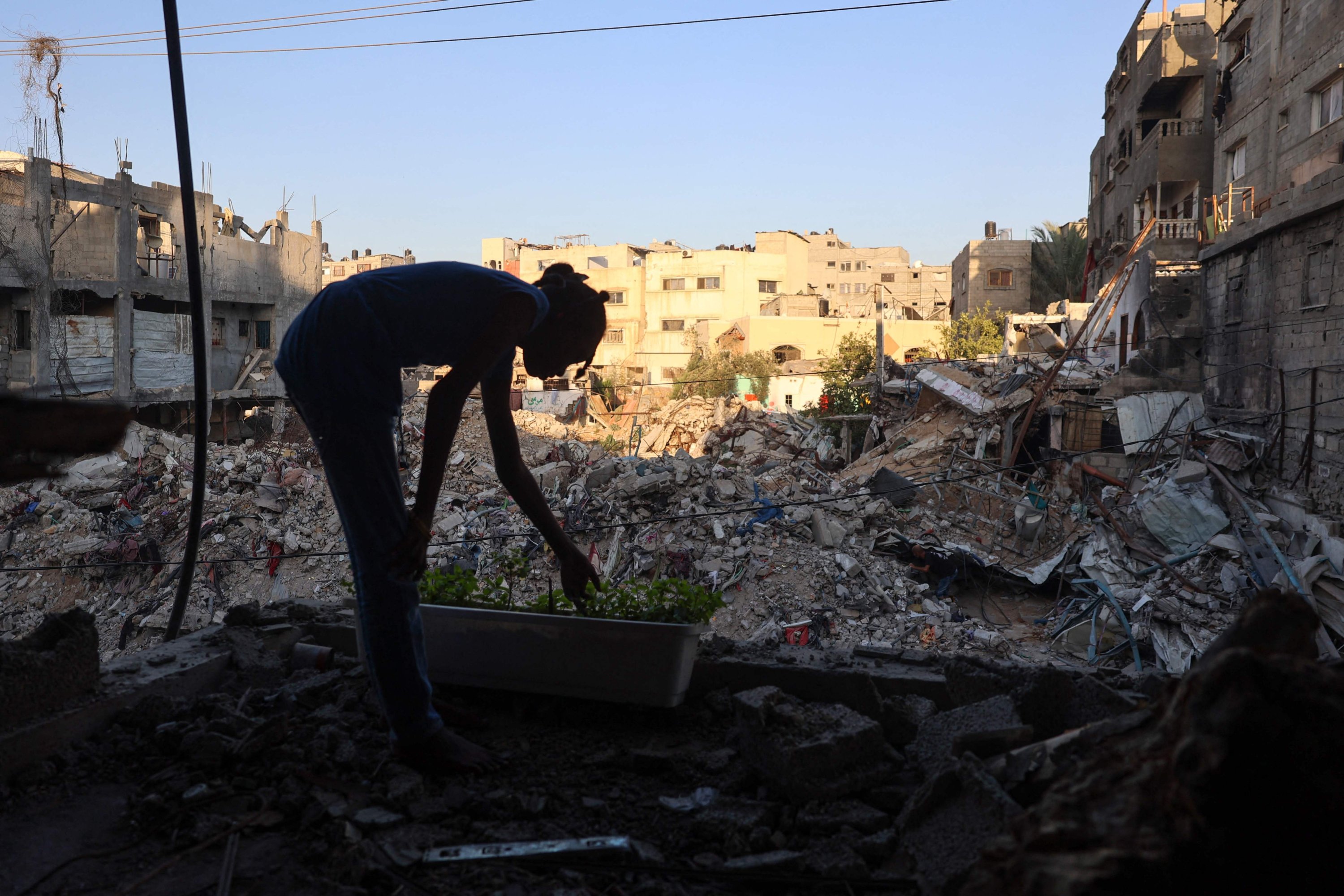 332576 A displaced Palestinian girl stands inside a damaged building used as a temporary shelter in al-Bureij refugee camp, central Gaza Strip, Palestine, June 12, 2024. (AFP Photo)