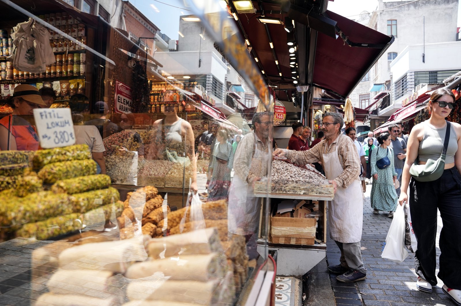 People are seen in the famous Eminönü neighborhood in Istanbul, Türkiye, June 13, 2024. (IHA Photo)