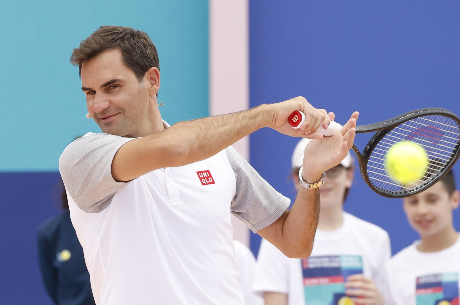 Tennis legend Roger Federer in action during an inauguration of a tennis court in La Courneuve, Paris, France, May 22, 2024. (EPA Photo)
