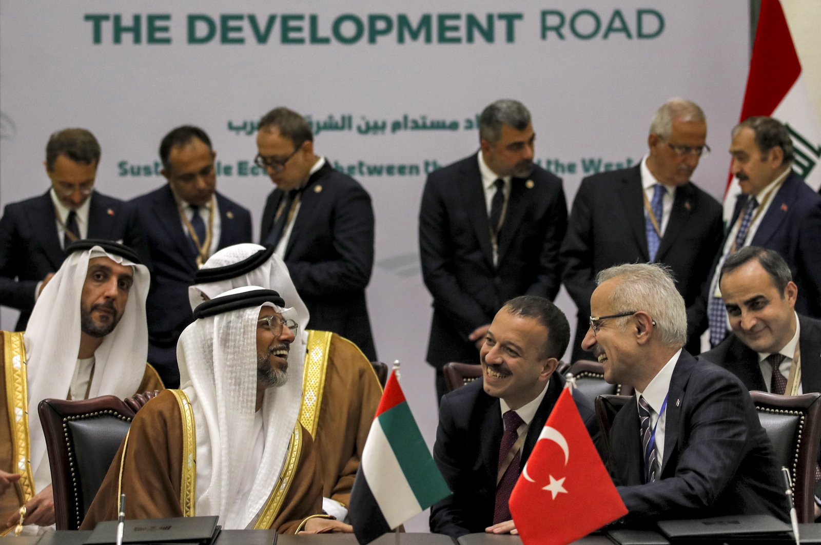 United Arab Emirates' Energy Minister Suhail Mohamed al-Mazrouei (L) and Türkiye's Transport Minister Abdulkadir Uraloğlu speak during the signing of the "Development Road" framework agreement in Baghdad, Iraq, April 22, 2024. (AP Photo)