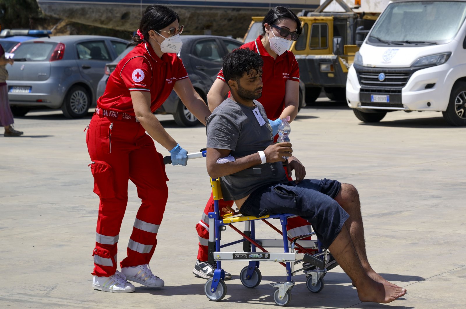 One of the 11 migrants saved from the sea is assisted by emergency workers in Roccella Ionica, southern Italy, June 17, 2024. (AP Photo)