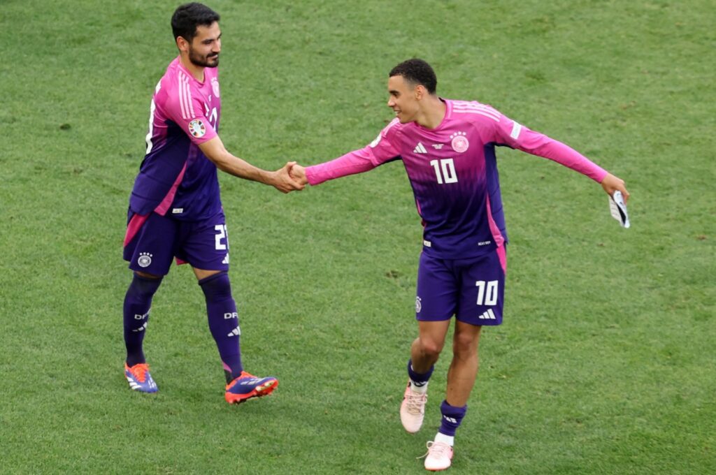 The goalscorers of Germany Ilkay Gündoğan (L) and Jamal Musiala shake hands after the UEFA EURO 2024 Group A match between Germany and Hungary, Stuttgart, Germany, June 19, 2024. (EPA Photo)