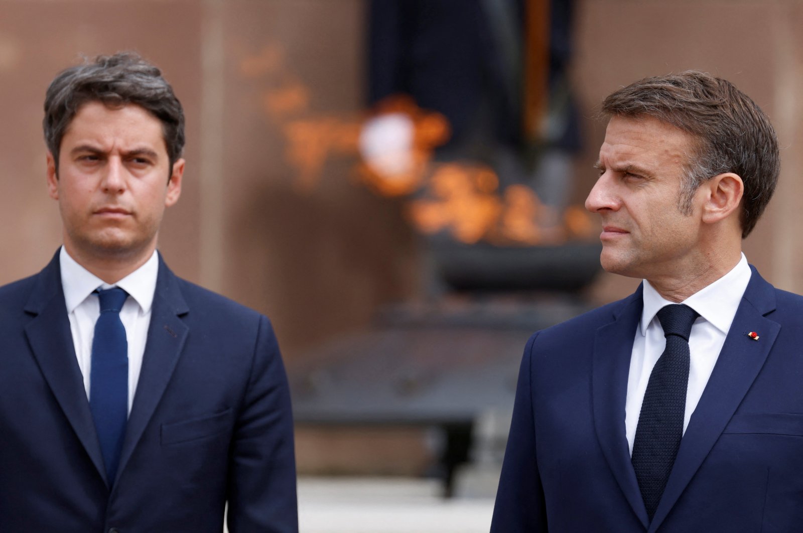 French President Emmanuel Macron and France's Prime Minister Gabriel Attal attend a ceremony marking the 84th anniversary of late French Gen. Charles de Gaulle's World War II resistance call of June 18, 1940, at the Mont-Valerien memorial, Suresnes, France, June 18, 2024. (Reuters Photo)