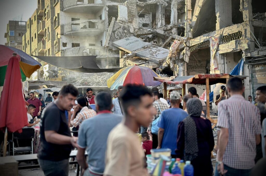 Palestinians go on with their daily lives amid the ruins of buildings destroyed by Israeli attacks in Nuseirat refugee camp, central Gaza, Palestine, June 20, 2024. (AA Photo)