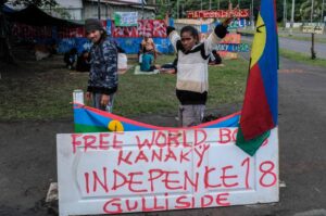 Protesters stand on an encampment set up in the Riviere Salee district of Noumea, New Caledonia, June 12, 2024. (AFP Photo)