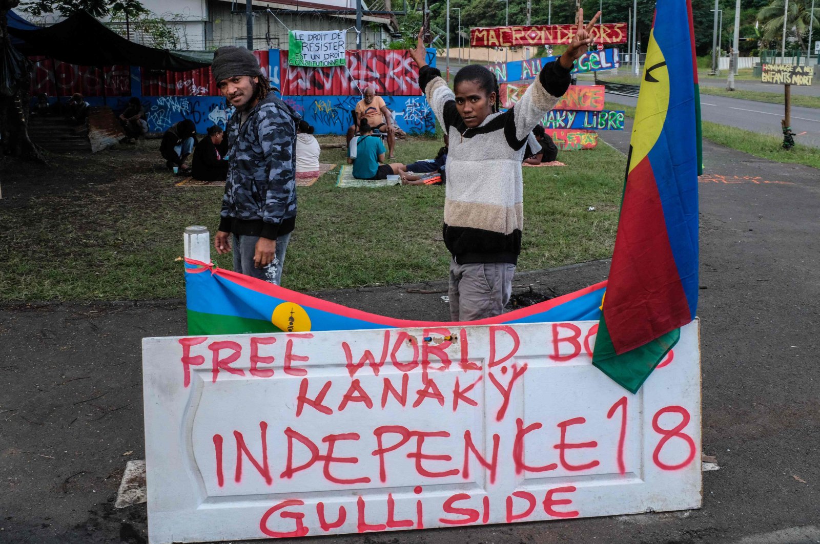 Protesters stand on an encampment set up in the Riviere Salee district of Noumea, New Caledonia, June 12, 2024. (AFP Photo)