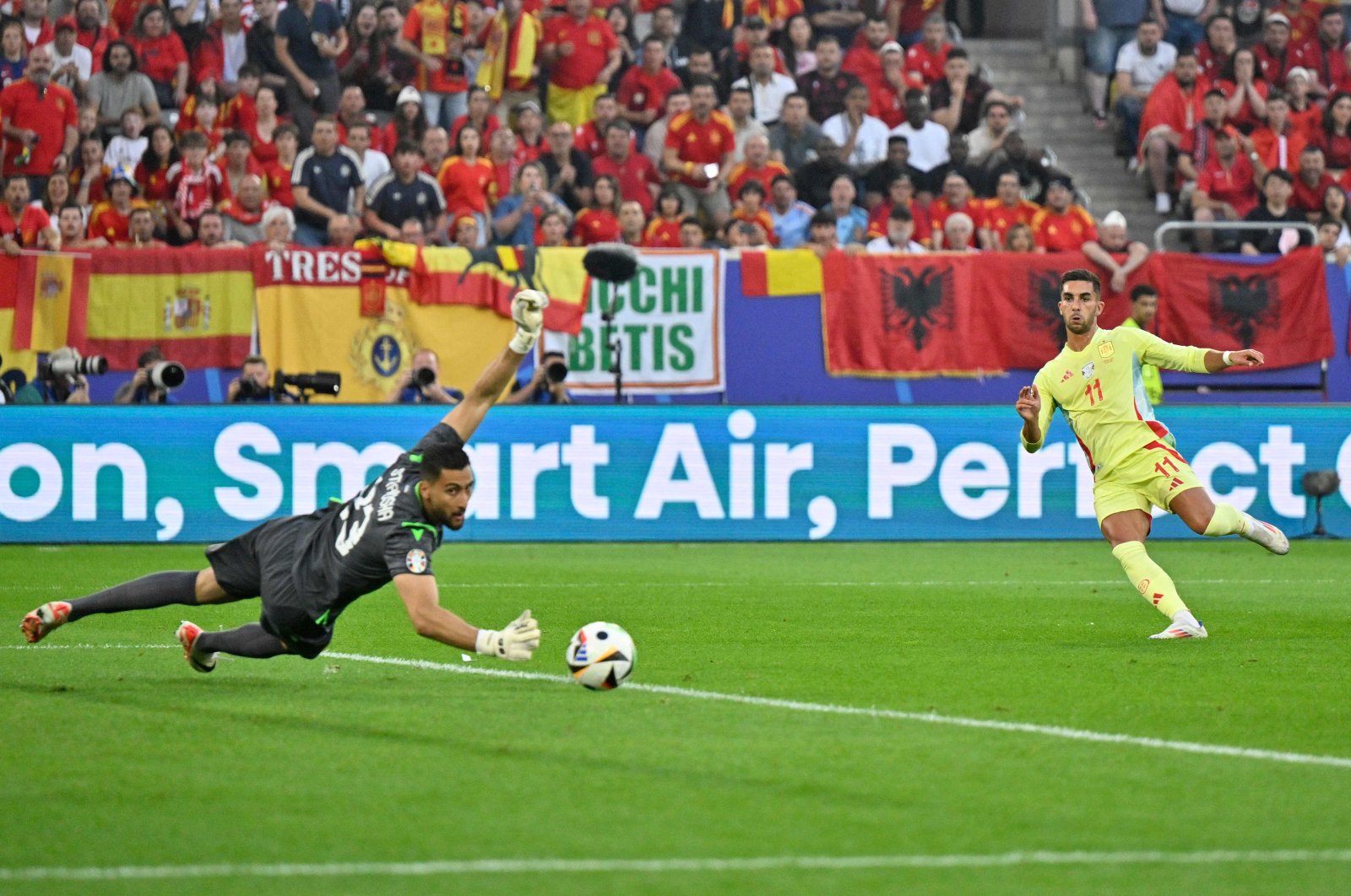 Spain's Ferran Torres (R) scores his team's first goal past Albania's Thomas Strakosha during the UEFA Euro 2024 Group B football match between Albania and Spain at the Duesseldorf Arena, Duesseldorf, Germany, June 24, 2024. (AFP Photo)