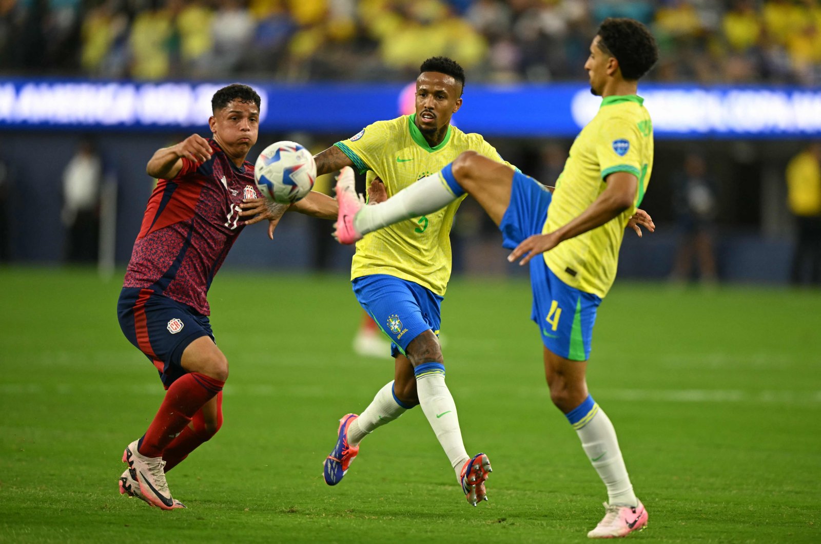Costa Rica's Warren Madrigal (L) fights for the ball with Brazil's Marquinhos (R) and Eder Militao during the Conmebol 2024 Copa America tournament Group D football match between Brazil and Costa Rica at SoFi Stadium, Inglewood, California, U.S., June 24, 2024. (AFP Photo)