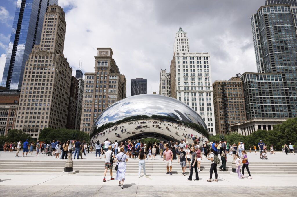Visitors take photos of the "Cloud Gate" sculpture, also known as the "Bean," at Millennium Park, Chicago, U.S., June 23, 2024. (AP Photo)
