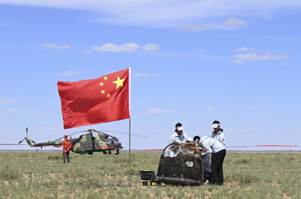 Workers access the returned capsule of the Chang'e 6 probe in Siziwang Banner, northern China's Inner Mongolia Autonomous Region, June 25, 2024. (AP Photo)