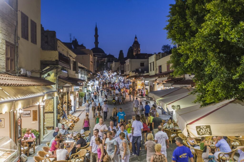 Tourists are photographed in Sokratus Street of Rhodes island in this undated photo, Greece. (Getty Images Photo)