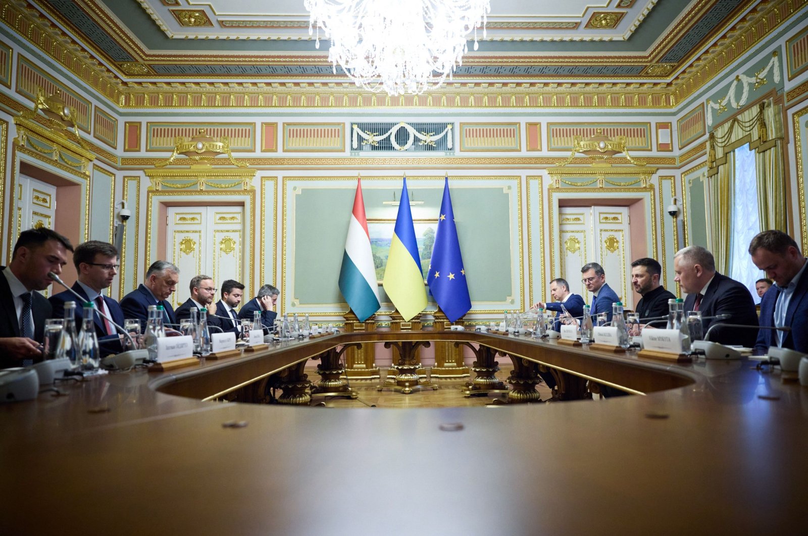 This handout photograph taken and released by Ukrainian Presidential Press Service on July 2, 2024, shows Ukraine's President Volodymyr Zelenskyy (3rd-R) and Hungary's Prime Minister Viktor Orban (3rd-L) attend a bilateral meeting in Kyiv. (AFP Photo)