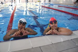 Turkish swimmers with Down syndrome Eren İçer (L) and Kumsal Dinibütün pose for a photo after a training session, Adana, Türkiye, July 4, 2024. (AA Photo)