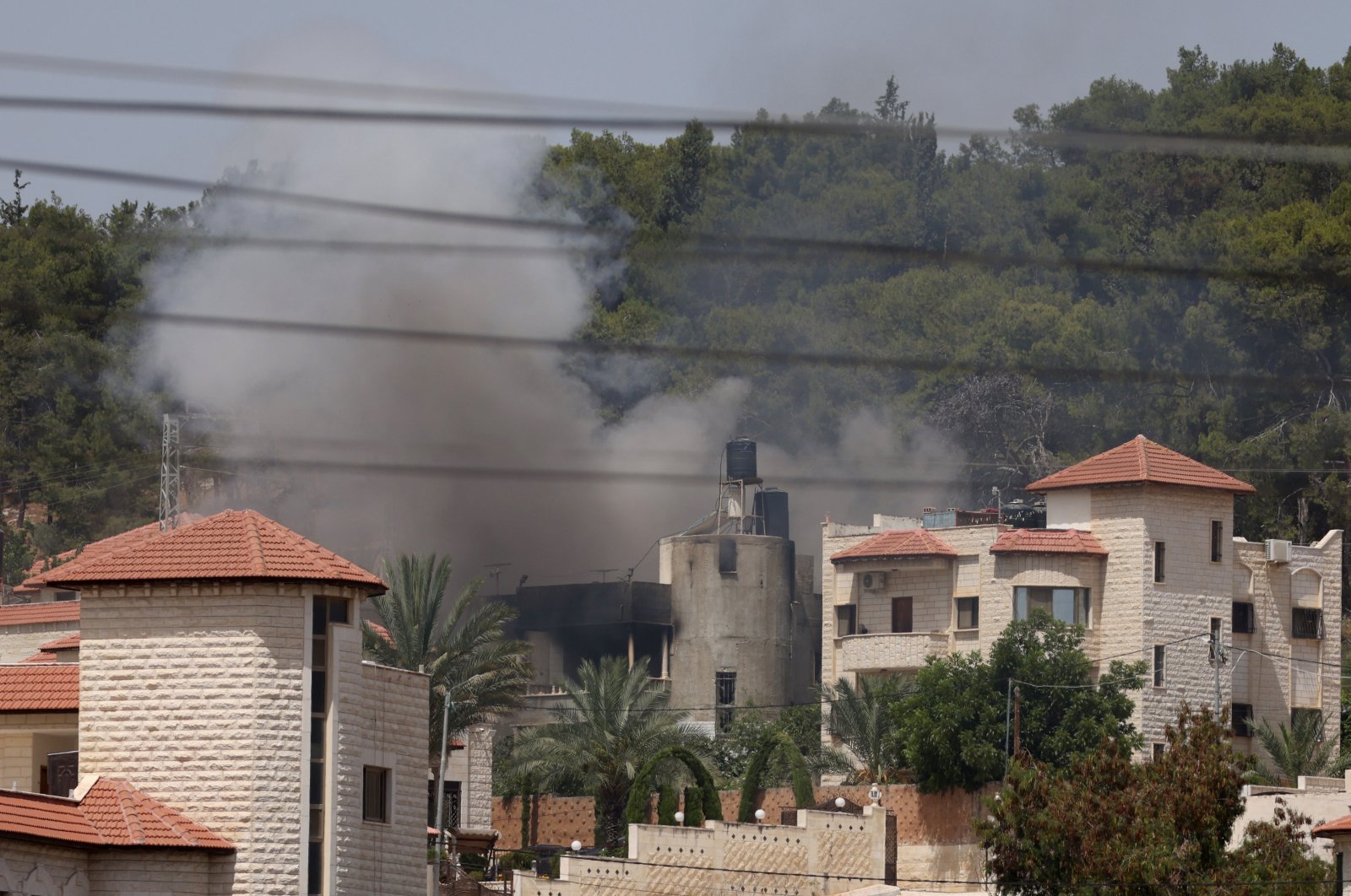 Smoke billows from a building during an Israeli military operation in the West Bank city of Jenin, Palestine, July 5, 2024. (EPA Photo)