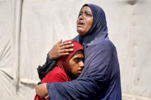 Palestinian people, who fled the eastern part of Khan Younis after they were ordered by the Israeli army to leave their neighborhood, react upon their arrival at Nasser hospital, Khan Younis, Gaza Strip, Palestine, July 2, 2024. (Reuters Photo)