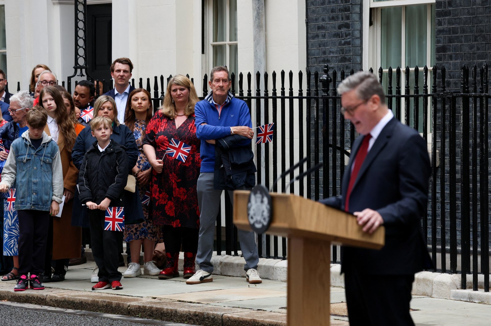 Guests watch as new British Prime Minister Keir Starmer delivers his speech outside Number 10 Downing Street, following the results of the general election, in London, Britain, July 5, 2024. (Reuters Photo)