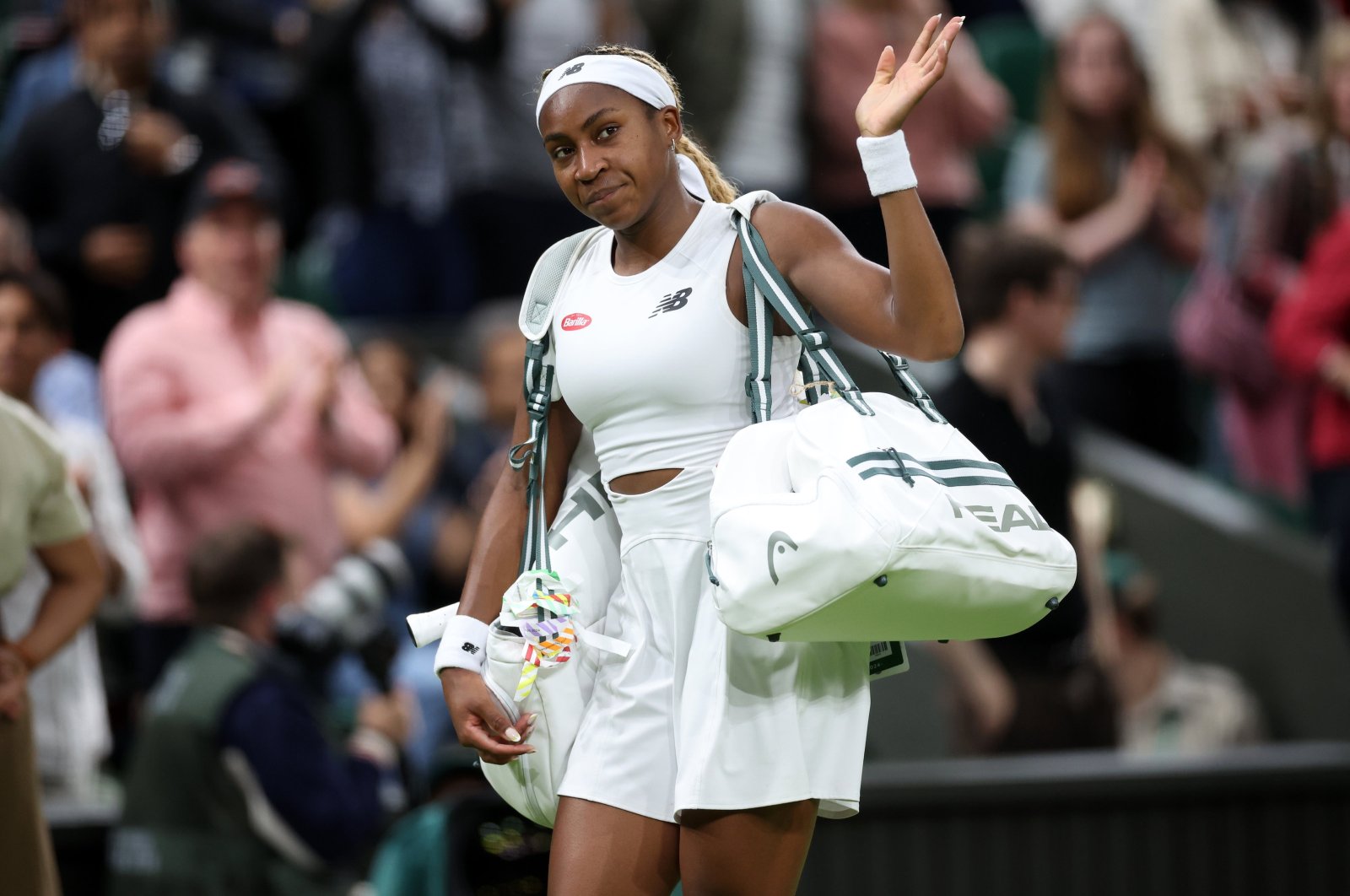 U.S.' Coco Gauff greets the crowd as she leaves the pitch after losing to Emma Navarro during their round of 16 match at the Wimbledon Championships, Wimbledon, London, U.K., July 7, 2024. (EPA Photo)